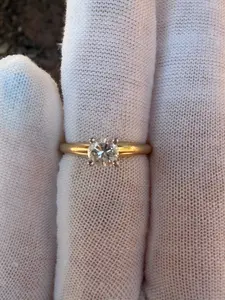 Solitaire engagement ring features a sparkling .50 carat natural round diamond