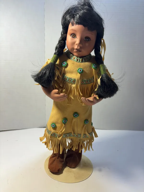 Native American Style Bisque Porcelain Collector Doll in Fringed Yellow Dress from auction in Brewton, Alabama — image 5