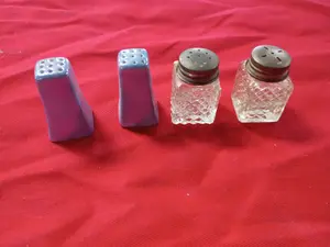 A Collection of Ceramic and Diamond Pattern Glass Salt and Pepper Shakers