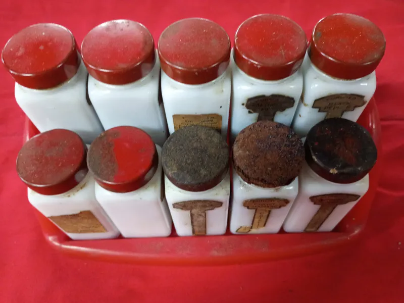 Set of Ten Griffith Laboratories Milk Glass Spice Jars with Red Carrier from auction in Brewton, Alabama — image 29