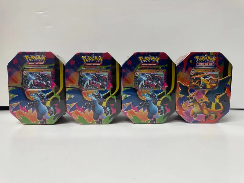 Pokemon Trading Card Game Charizard Tins (Set of 4) from auction in Cranston, Rhode Island — image 37