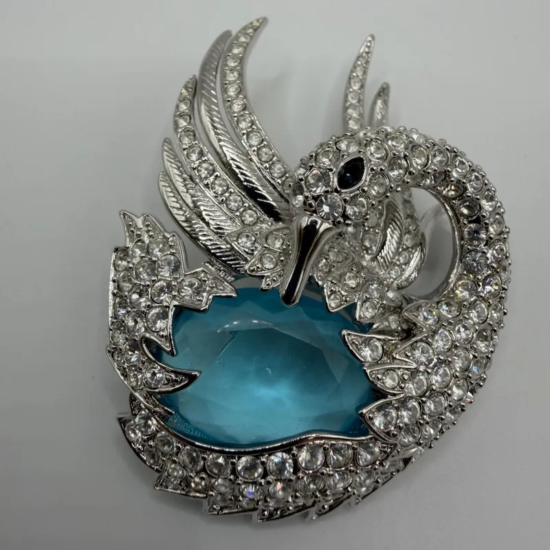 Silver Tone Nolan Miller Crystal Swan Brooch with Blue Cabochon Center Accent from auction in Orlando, Florida — image 22