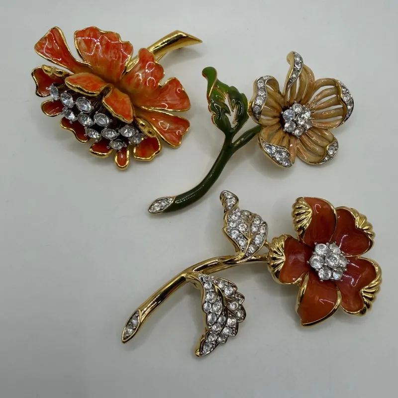 Group of Three Nolan Miller Floral Enamel and White Clear Rhinestone Designer Brooches AB22 from auction in Orlando, Florida — image 40