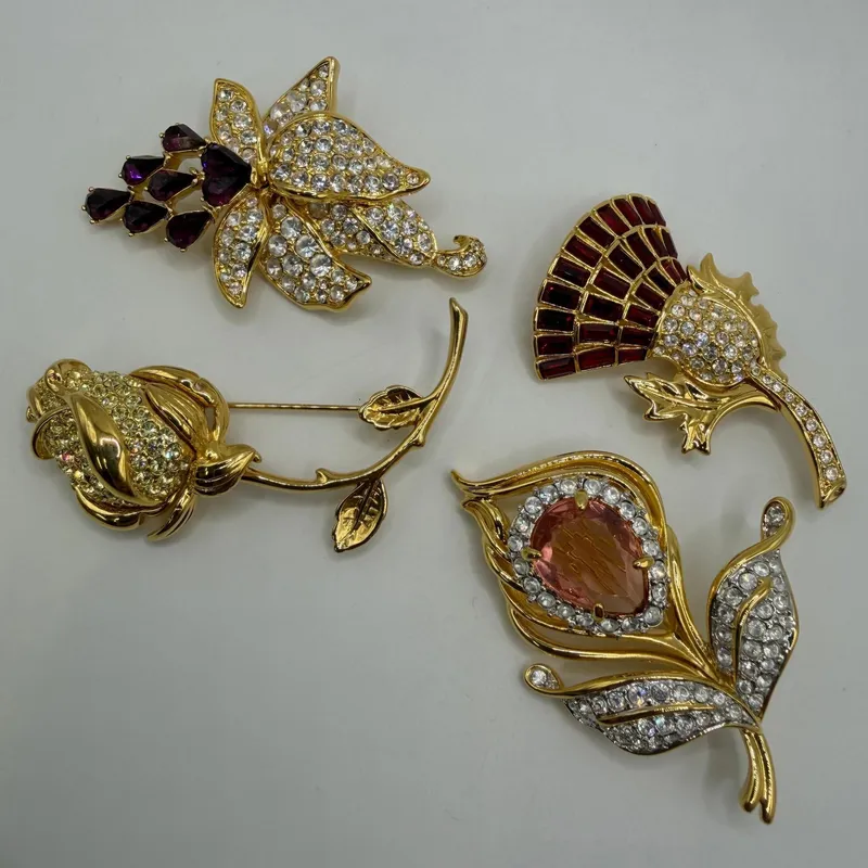 Group of Four Nolan Miller Floral Rhinestone Designer Brooches AB23 from auction in Orlando, Florida — image 44