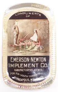 Emerson-Newton Implement Co. paperweight