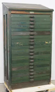 Early wooden printer's typesetting cabinet