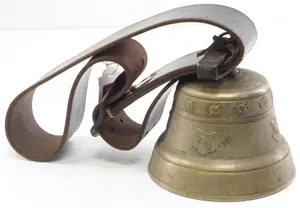Brass cowbell on wide leather strap