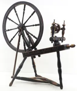Early wooden spinning wheel