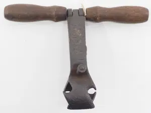 Early embossed T-handle hand corn sheller