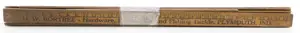 Bundle of early wooden advertising yardsticks