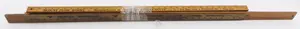 Bundle of early wooden advertising yardsticks