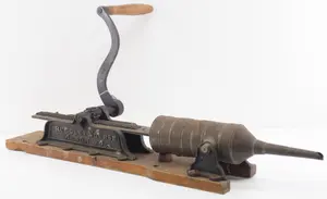 Early hand-crank sausage stuffer and press