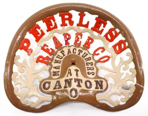 Peerless Reaper Co. cast iron seat