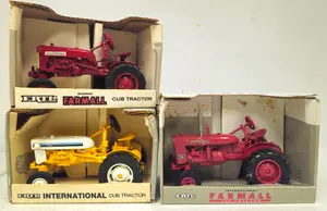 (3) International Cub Tractors