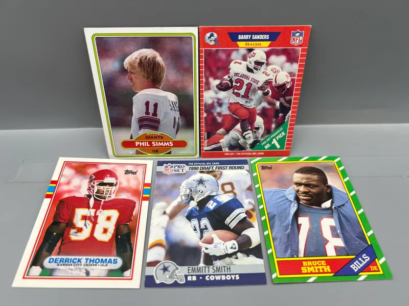(5) 1980s & 90s Football Star Player Rookie Cards - Varying Conditions - Barry Sanders RC, Emmitt Smith RC, Phil Simms RC from auction in Greenville, Ohio — image 43