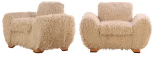 LARGE PAIR OF LOUNGE CHAIRS IN THE MANNER OF JEAN ROYERE UPHOLSTERED IN FAUX GOAT HAIR.