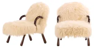 PAIR OF LOUNGE CHAIRS WITH FAUX GRAY HAIR UPHOLSTERY IN THE MANNER OF JEAN ROYERE.