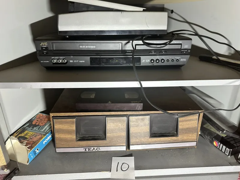 JVC VCR/DVD combo with Tape rewinder and assorted media on sheves from auction in Clifford , Pennsylvania — image 7