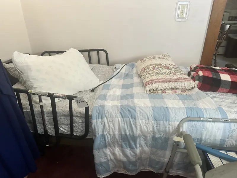 Drive Electric Hospital Bed w/ Side Rail Drive electric adjustable hospital bed with remote control and Guardian side rail. Includes mattress and bedding shown unless removed prior to sale. Untested by auctioneer; used medical/home care equipment. Shows use/storage wear. Buyer responsible for proper — image 23