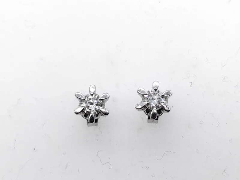 A Pair of Diamond and Platinum Flower Style Stud Earrings from auction in Atlanta, Georgia — image 36