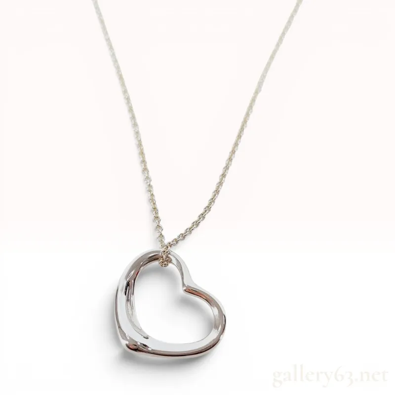 Tiffany & Co. Elsa Peretti Sterling Silver Open Heart Pendant Necklace from auction in Atlanta, Georgia — image 17