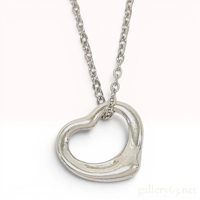 Tiffany & Co. Elsa Peretti Sterling Silver Open Heart Pendant Necklace from auction in Atlanta, Georgia — image 29