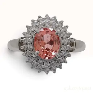 A Platinum Padparadscha Sapphire and Diamond Halo Cluster Ring size 5.25
