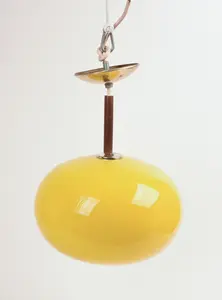 ITALIAN PENDANT LAMP WITH YELLOW GLASS SHADE.