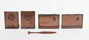 TWO PAIRS OF ROYCROFT HAMMERED COPPER BOOKENDS AND A LETTER OPENER.