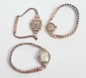 THREE ROLLED GOLD LADIES WATCHES.