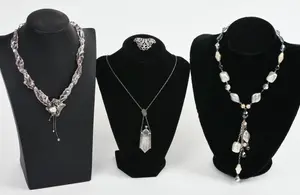 THREE NECKLACES AND A BROOCH.