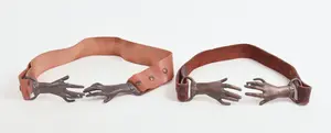 TWO BRASS AND LEATHER HAND BELTS.