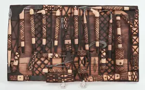WOODEN WALL ART WITH MINIATURE TOOLS.