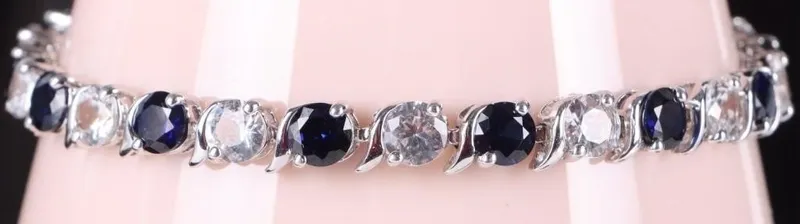 13.5CT SAPPHIRE & WHITE TOPAZ TENNIS BRACELET from auction in Tallahassee, Florida — image 12