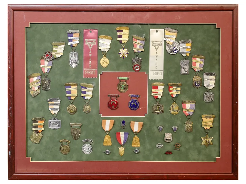 A COLLECTION OF MARKSMANSHIP BADGES IN A FRAME, 1954-1957 from auction in New York, New York — image 20