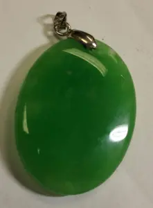 Oval jade & 18k gp pendant 67.5 carats