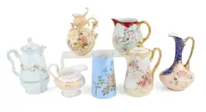 Seven Floral Decorated Porcelain Pitchers