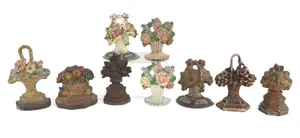 Nine Painted Cast-Iron Flower Basket Doorstops