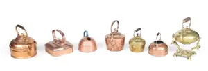 Seven Copper and Brass Kettles