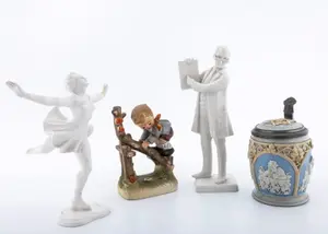 A BEER STEIN WITH A SIX POINTED STAR AND OTHER FIGURINES