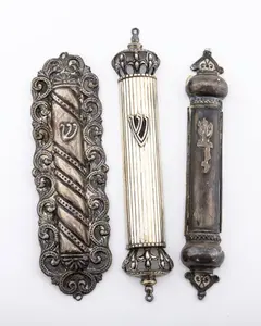 A GROUP OF THREE STERLING SILVER MEZUZAH COVERS