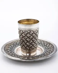 A STERLING SILVER KIDDUSH CUP AND PLATE BY HADDAD BROTHERS.