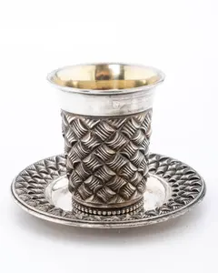 A STERLING SILVER KIDDUSH CUP AND PLATE