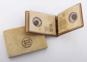 A COLLECTION OF FOUR ANCIENT JEWISH COINS IN THE ORIGINAL HOLDER