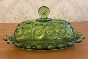 Pressed Green Glass Covered Butter Dish in Moon and Star Pattern