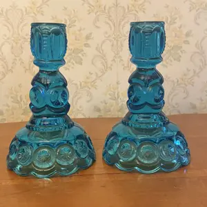 A Pair of Blue Pressed Glass Moon and Star Candlesticks