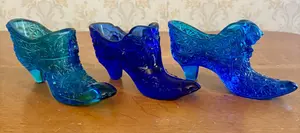 Three Blue Pressed Glass Decorative Shoes Including Fenton Rose Pattern