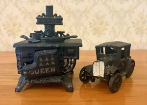 Two Miniature Cast Iron Toys Including a Queen Kitchen Range and Model T Style Coupe