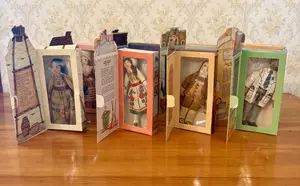 An Assortment of Vintage Hallmark Historical and Holiday Cloth Dolls in Original Display Boxes
