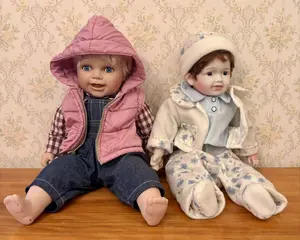 A Pair of Limited Edition Cathay Collection Porcelain Headed Dolls